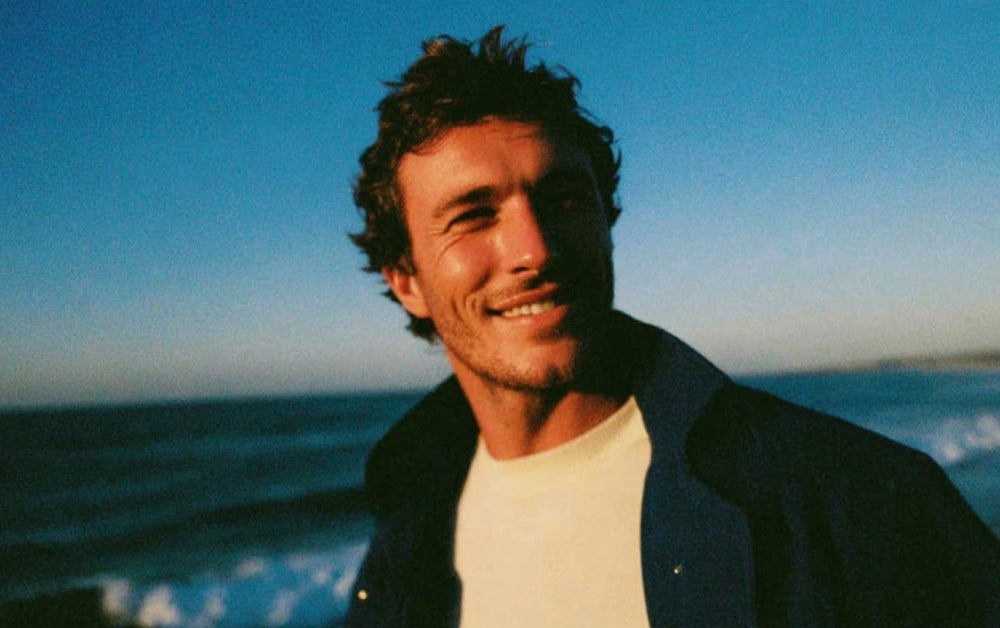 Smiling man on beach.