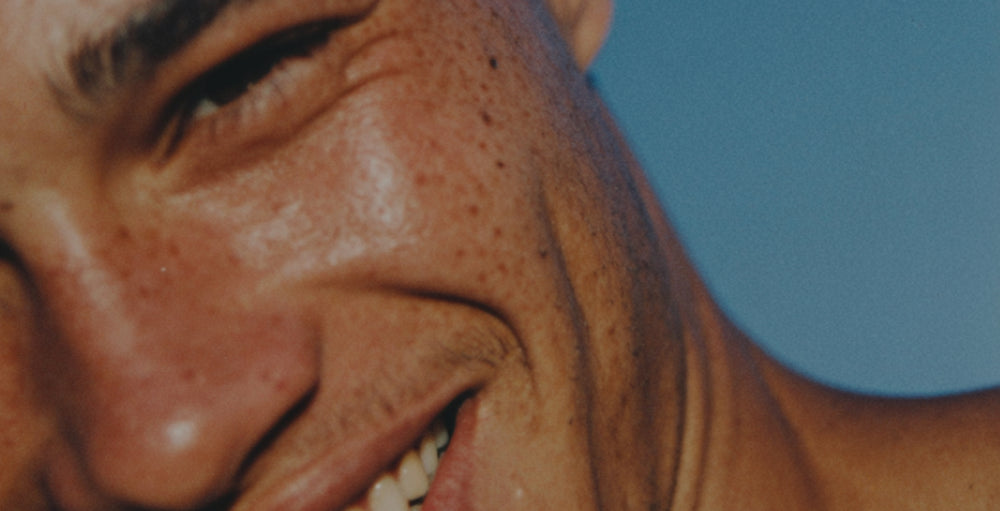 Close up shot of smiling man.
